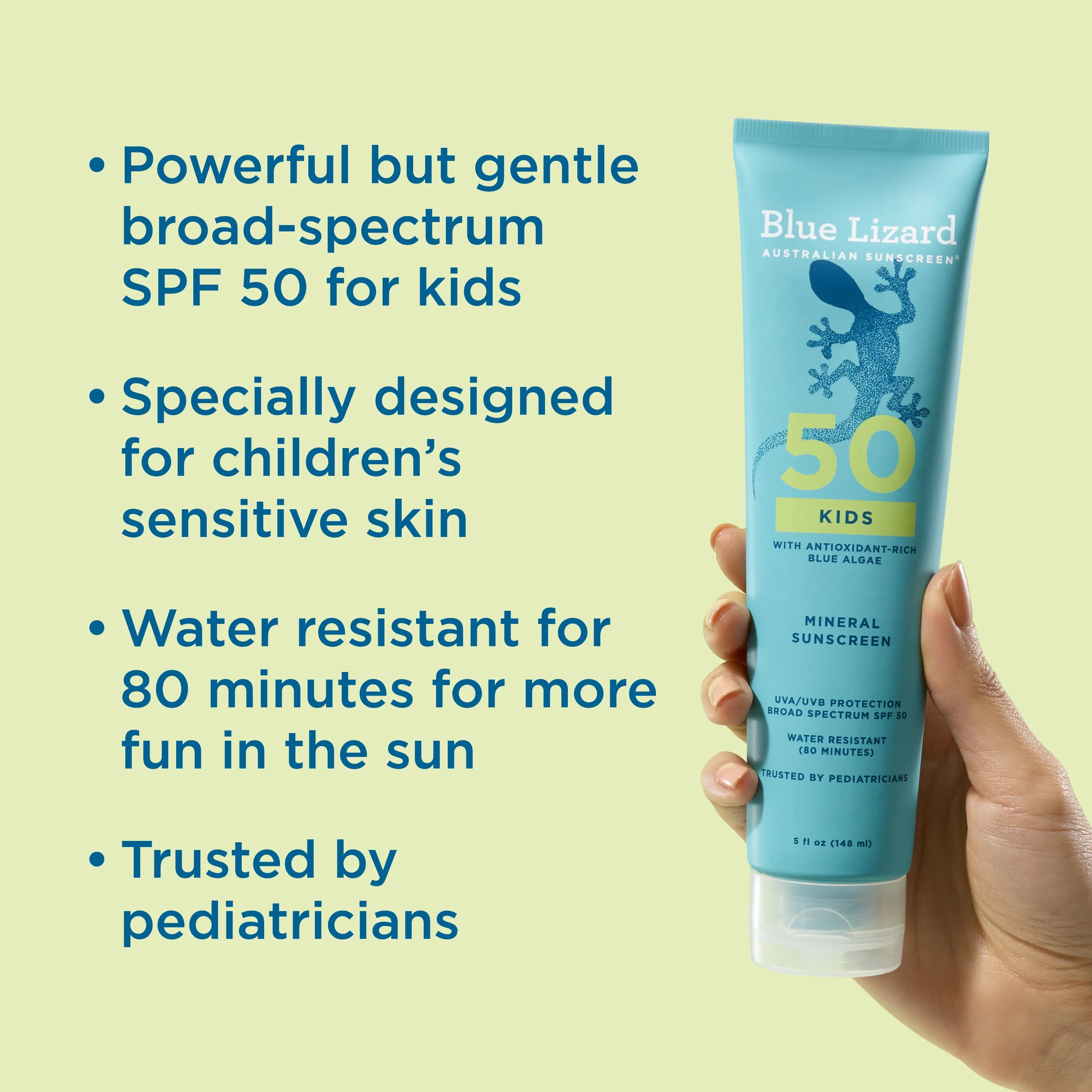 Hand holding Blue Lizard Kids SPF 50 mineral sunscreen lotion  tube with product features listed on a light green background