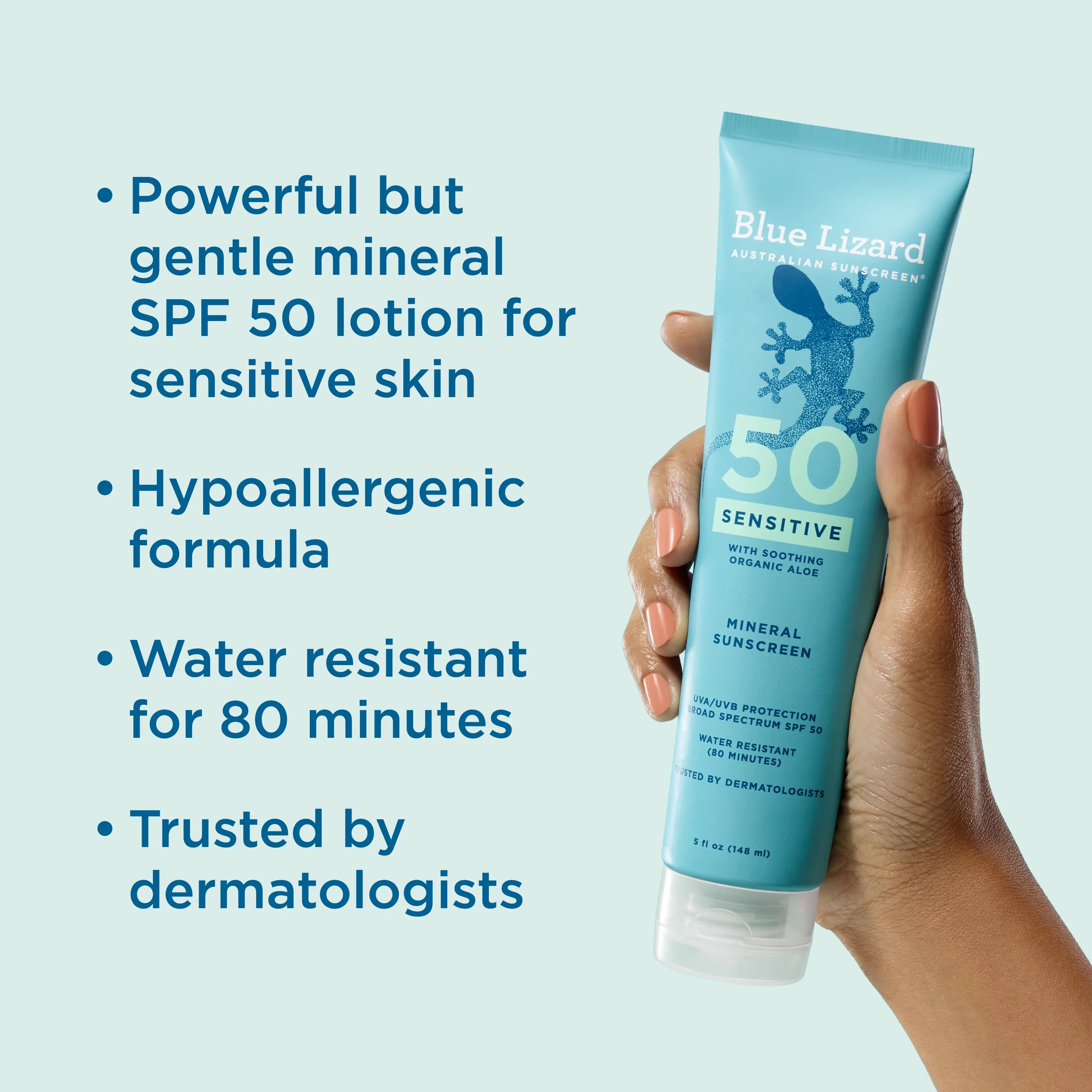 Blue Lizard sensitive SPF 50 mineral sunscreen tube held by a hand with product features listed on a light blue background